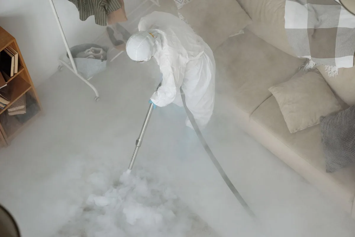 Biohazard cleanup technician in protective equipment, Oakes, ND